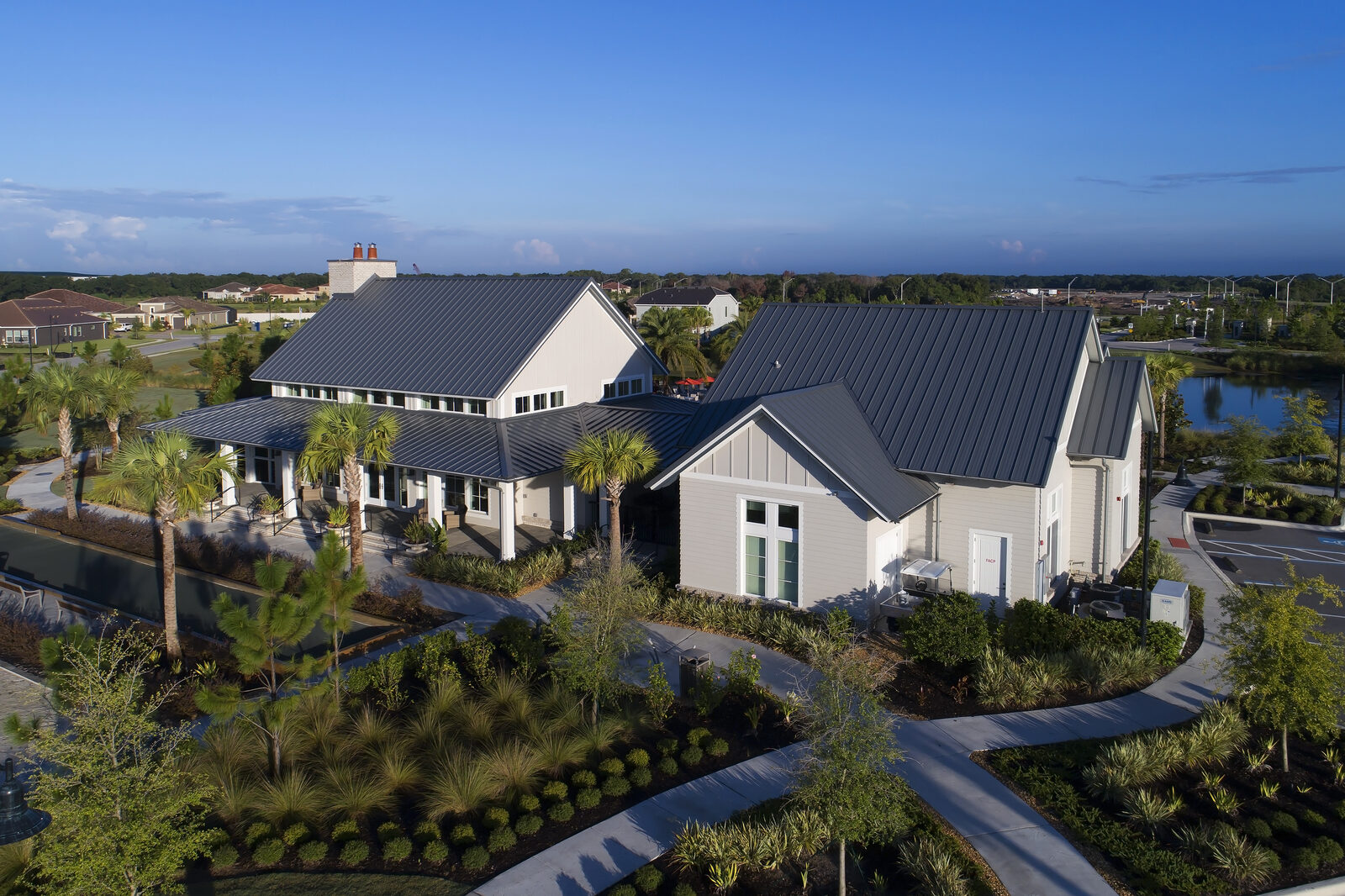 Drone view of homes with standing seam metal roofs